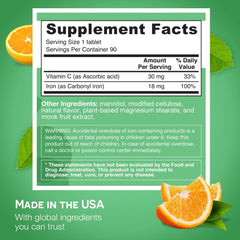 Close-up of orange flavor label on EZ Melts iron supplement bottle.