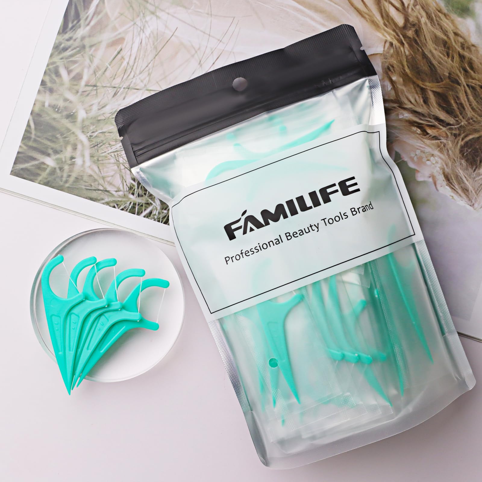Floss picks removing food debris between teeth