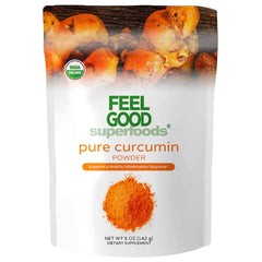 FEEL GOOD Curcumin Powder in a jar with a scoop on a wooden surface