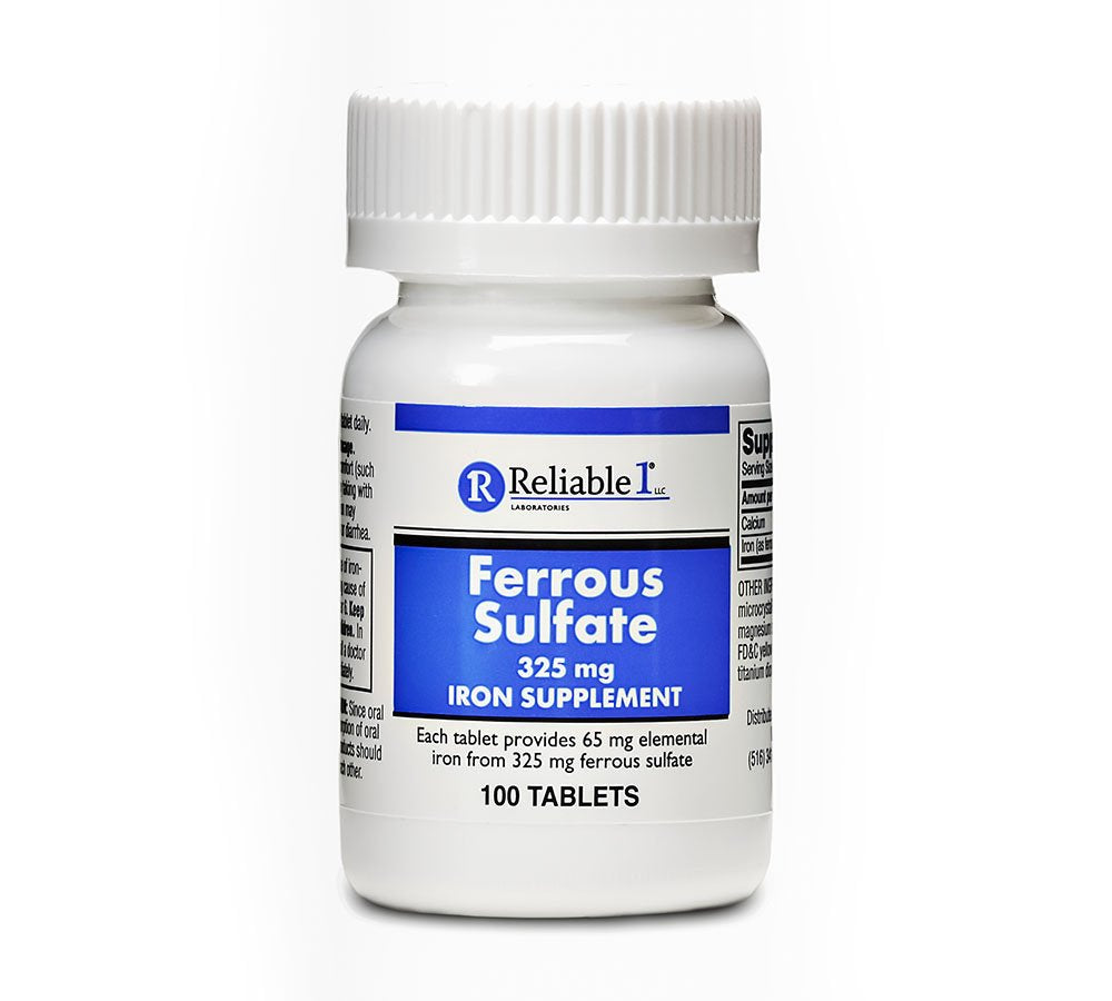 Close-up of a ferrous sulfate iron tablet showing 65 mg elemental iron