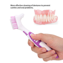 Close-up of lever-grip denture brush designed for limited dexterity