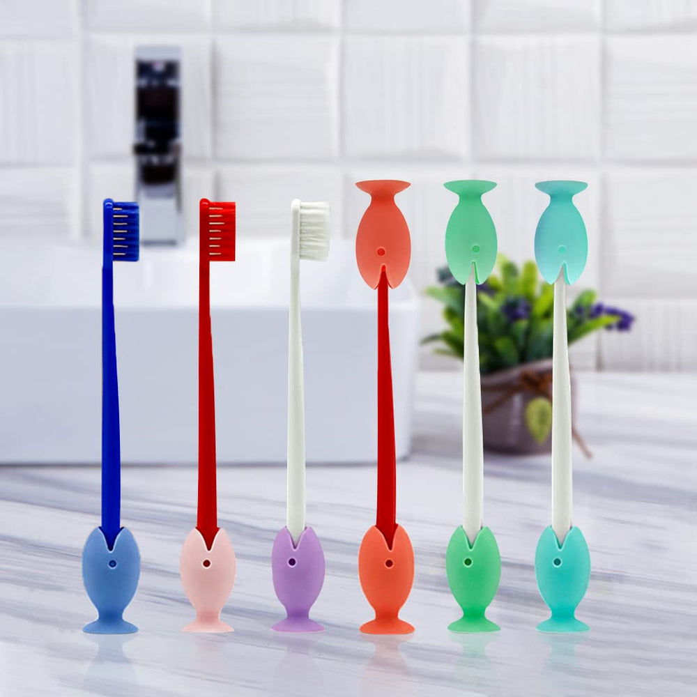Set of 12 mini fish toothbrush stand caps in bright colors