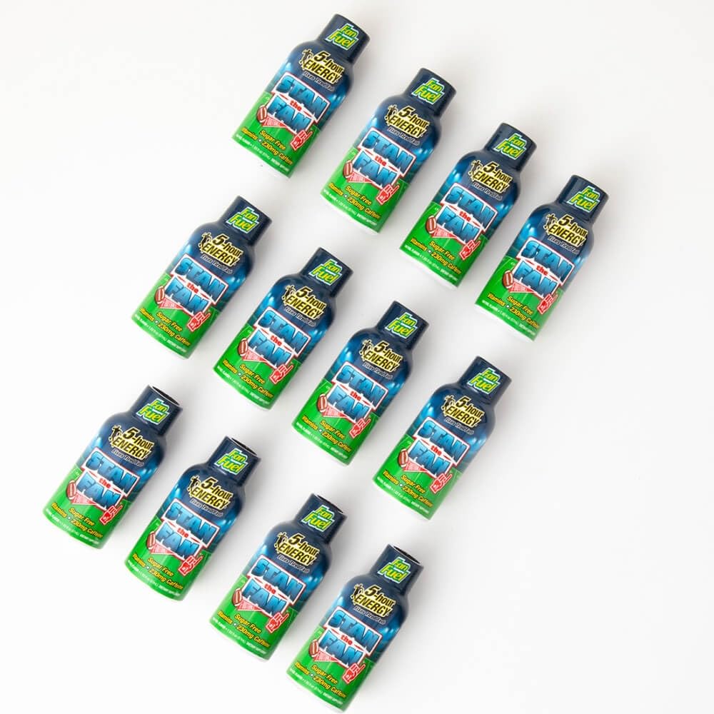 Five-hour ENERGY Fruity Candy Blend shot on a desk for fast alertness.