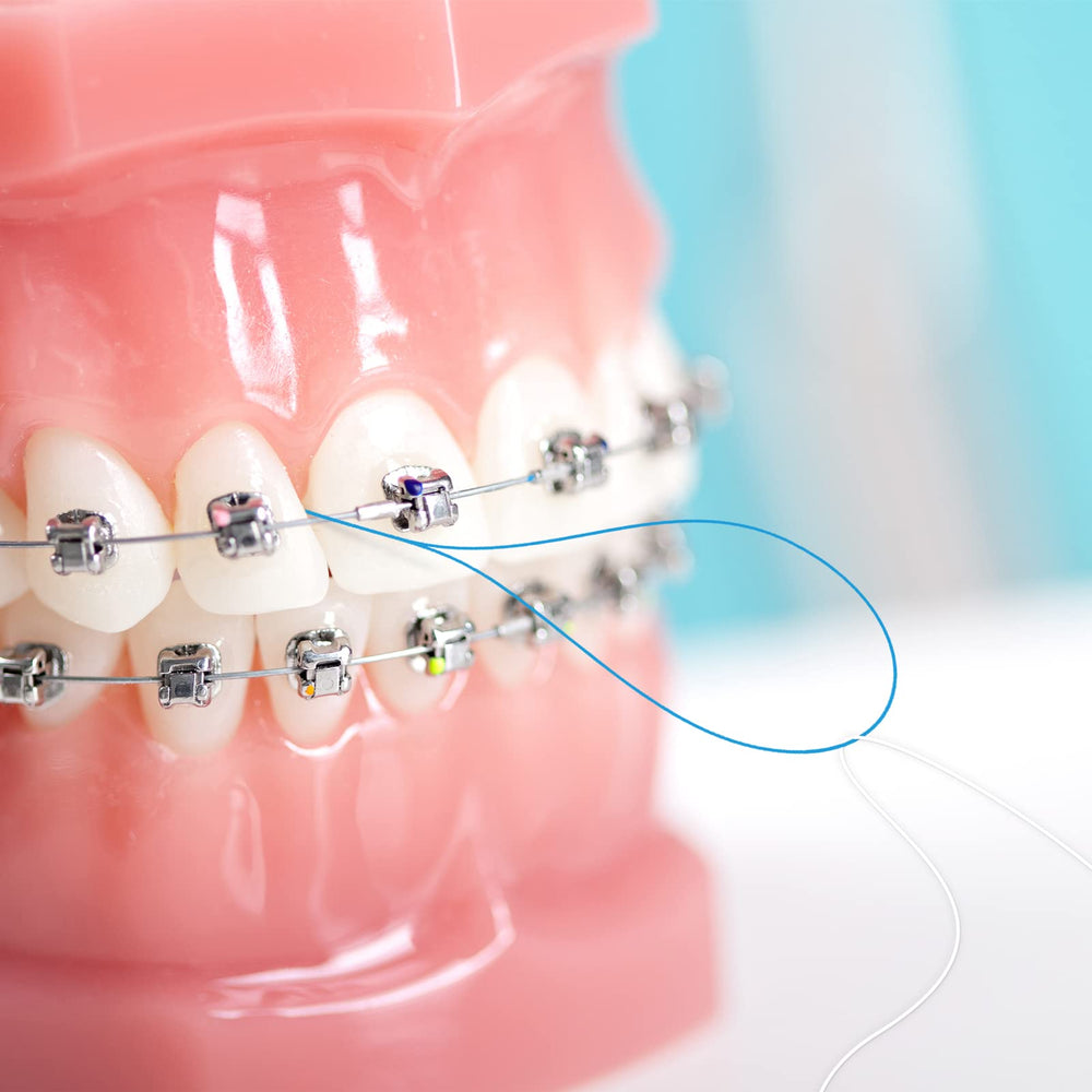 Blue floss threaders for braces and orthodontic appliances