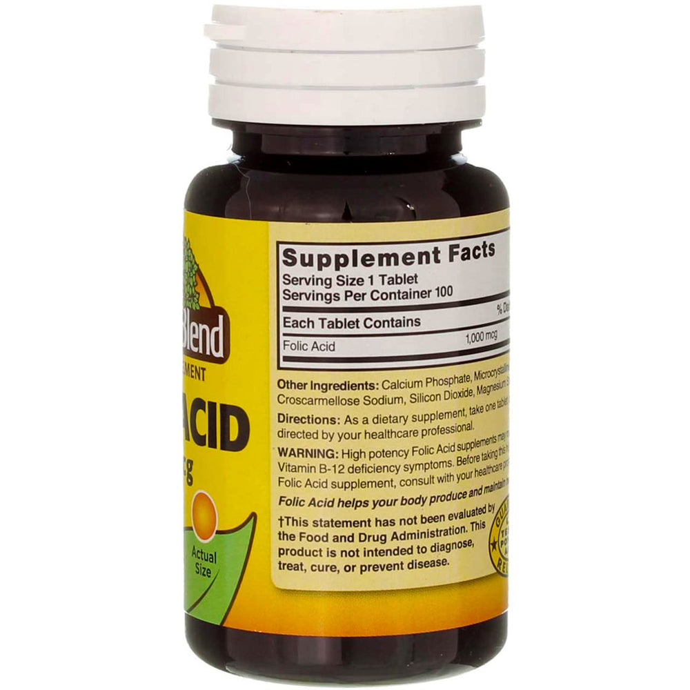 Loose folic acid 1000mcg tablets on white background