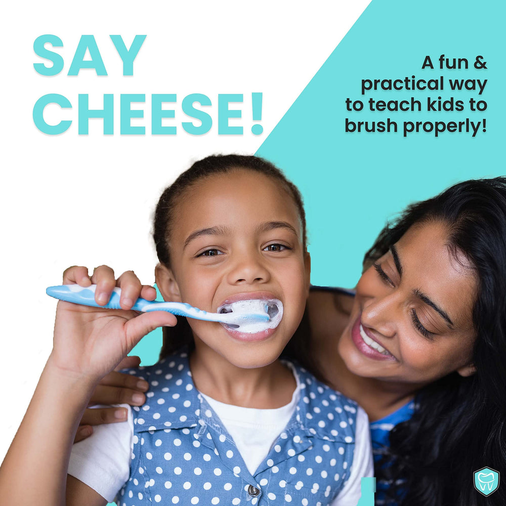 Child using plaque disclosing tablets for brushing practice