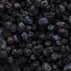 Close-up of bilberry berries showing blue-red pigment