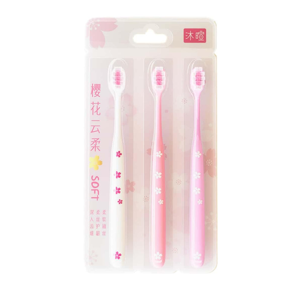 Close-up of pink cherry blossom toothbrush with sakura design