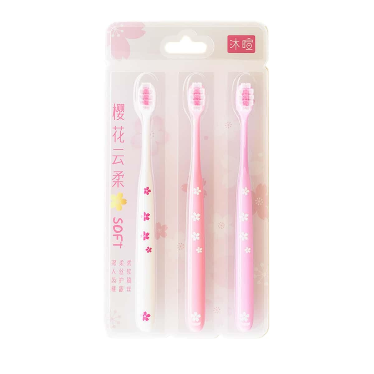 Close-up of pink cherry blossom toothbrush with sakura design