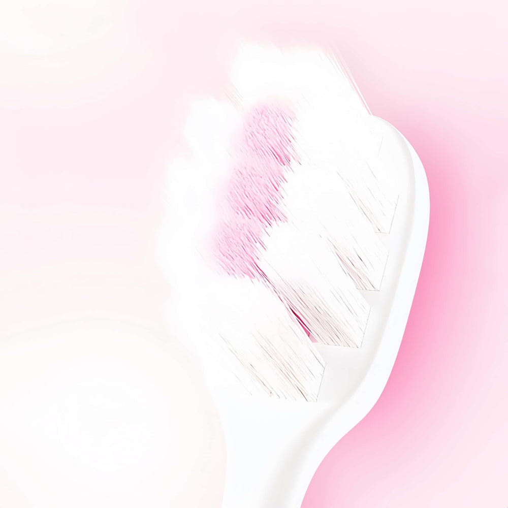 Slim, compact pink toothbrush for easy reach