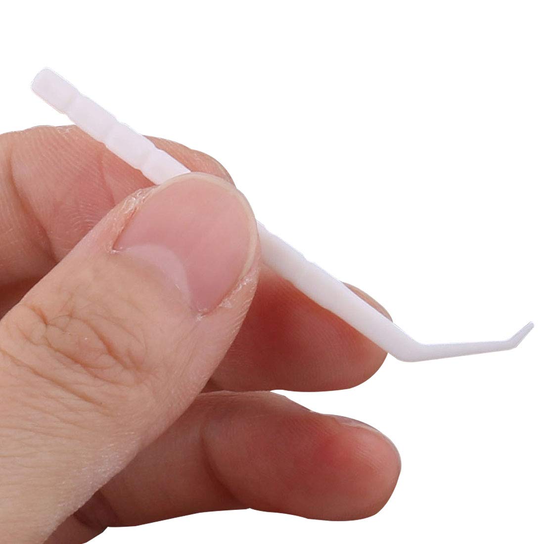Usage image showing GARASANI toothpick cleaning between teeth