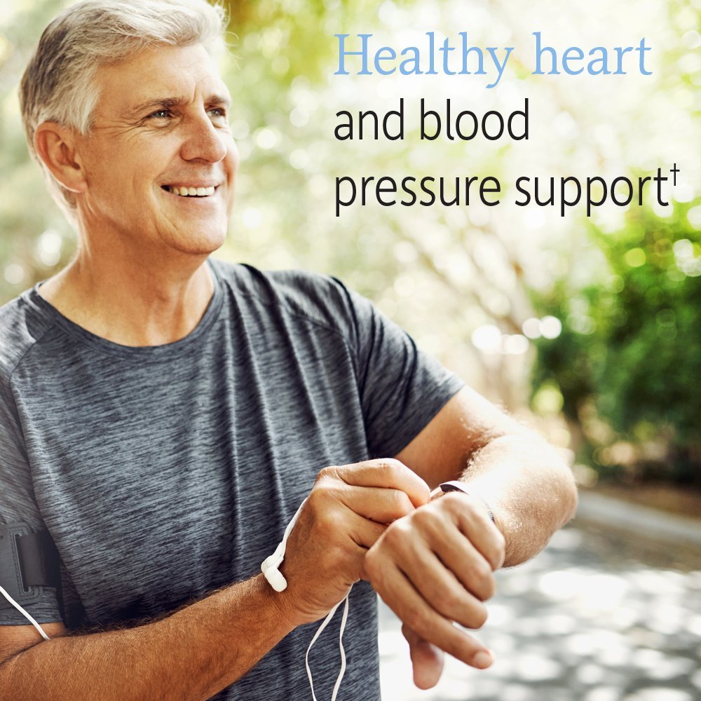 Close-up of probiotic capsules with raw fruits and vegetables imagery