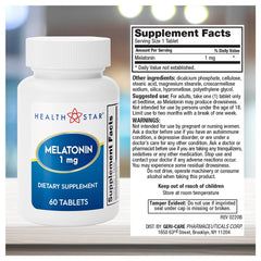 Close-up of white melatonin tablets (1mg each)