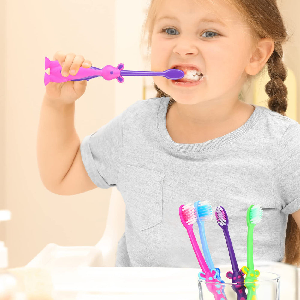 Pink kangaroo-shaped kids toothbrush with soft bristles