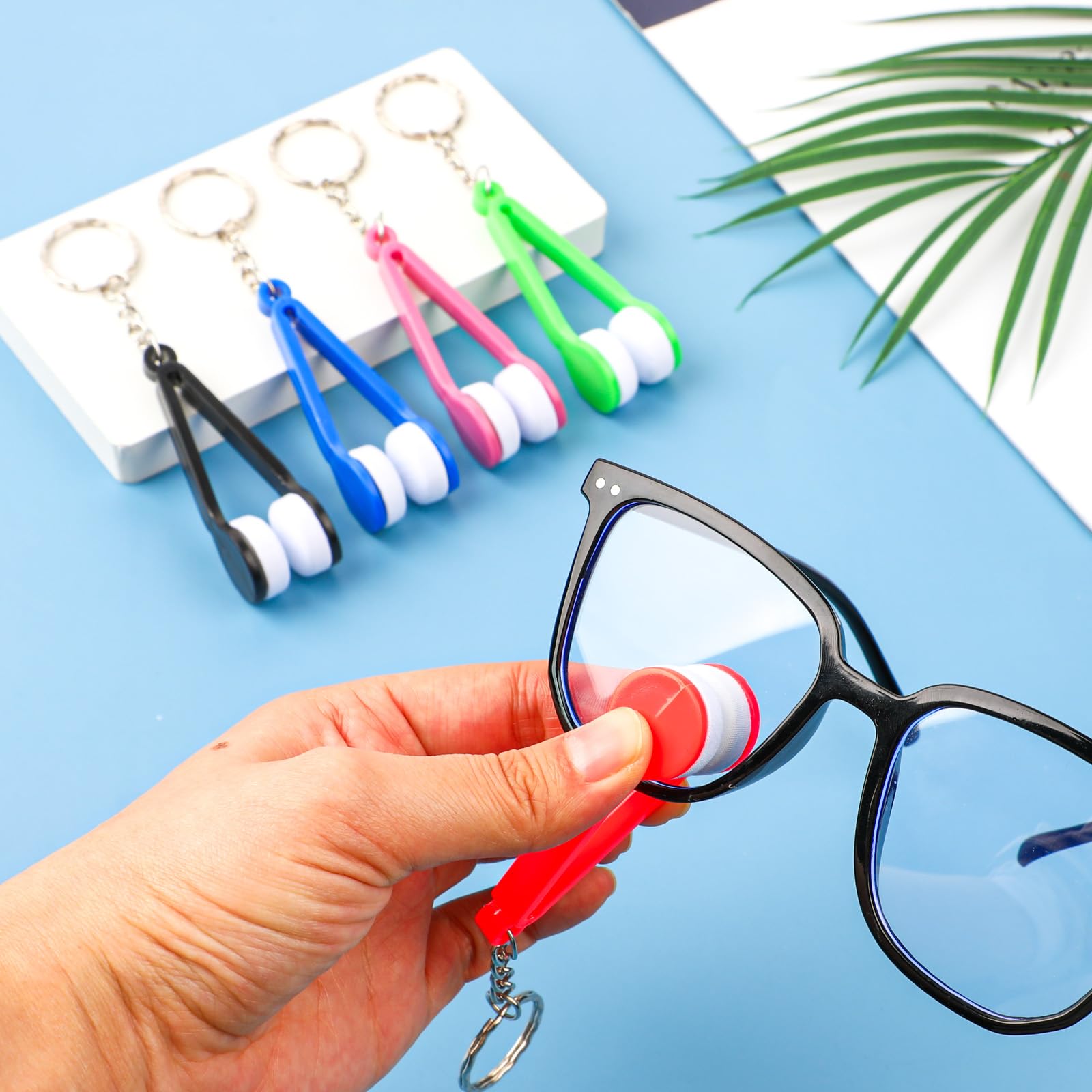 Purple tweezers-shaped glasses cleaning clip with keychain