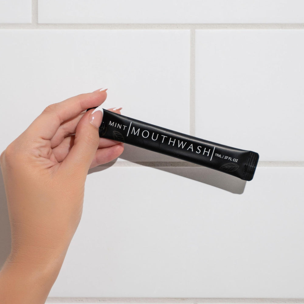 Guest bathroom amenities featuring mouthwash packets