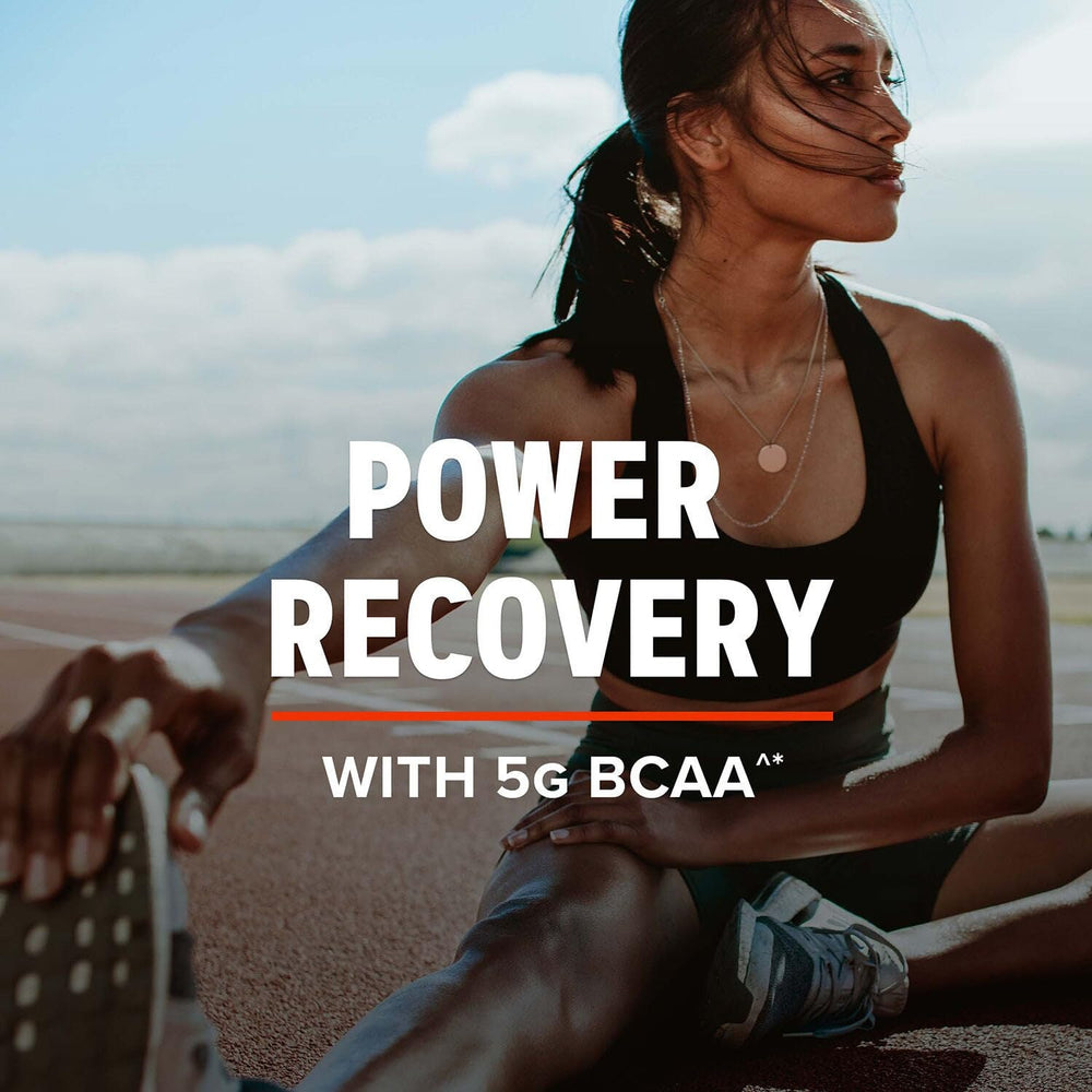 Pouring GNC AMP Pure Isolate Cookies & Cream into shaker