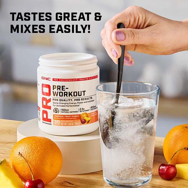 GNC Pro Performance Pre-Workout being prepared for use in a workout
