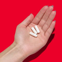 GNC Super Magnesium 400mg bottle on white background with 90 caplets