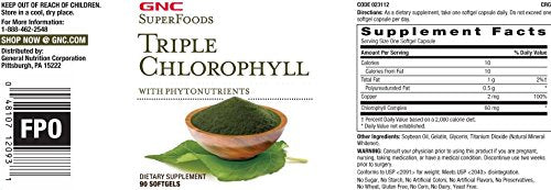 Pouring GNC Triple Chlorophyll softgels for a convenient daily intake.