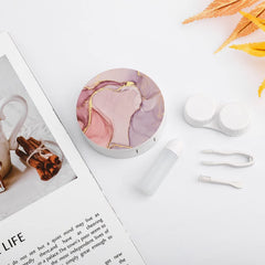 Travel kit components: lens case, tweezers, wearing stick, and solution bottle