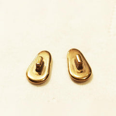 Push-in installation of gold titanium nose pads