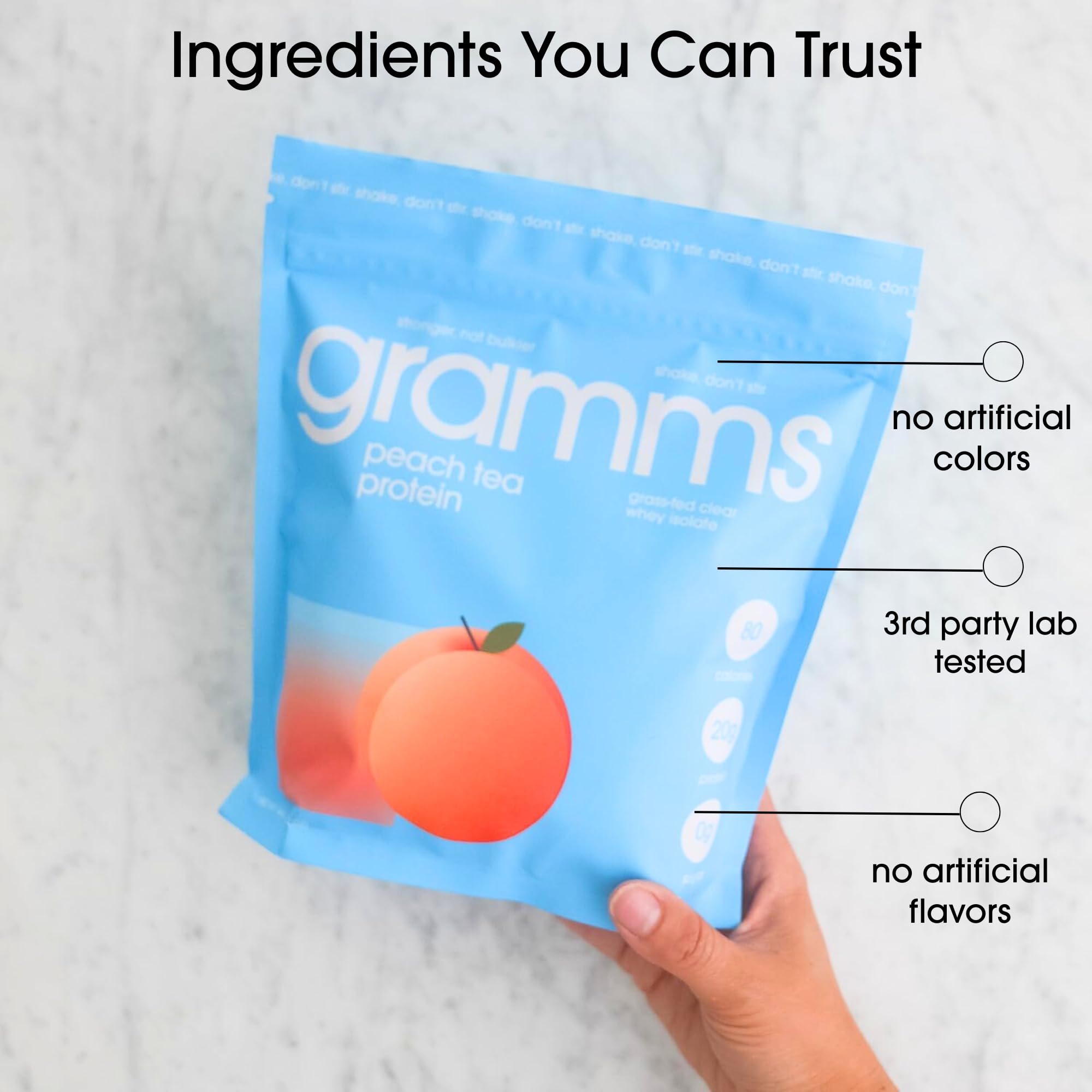 Protein water being poured into a glass with Peach Tea flavor