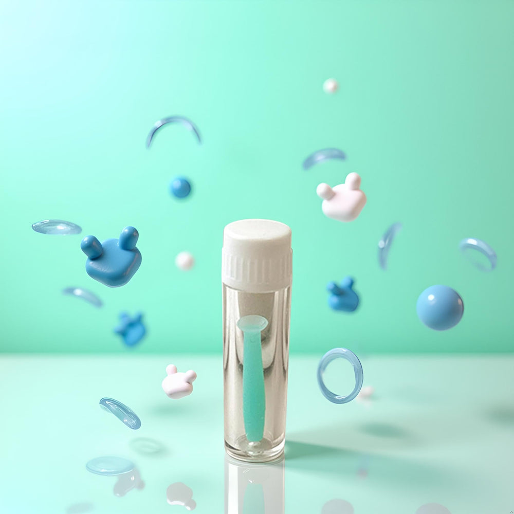 Hand holding the green silicone plunger remover for lens care