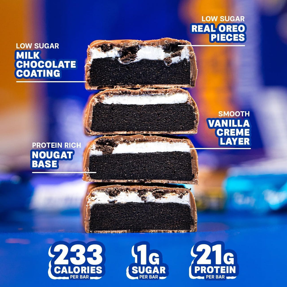 Grenade Vanilla Oreo bar cross-section reveals protein nougat and Oreo pieces.