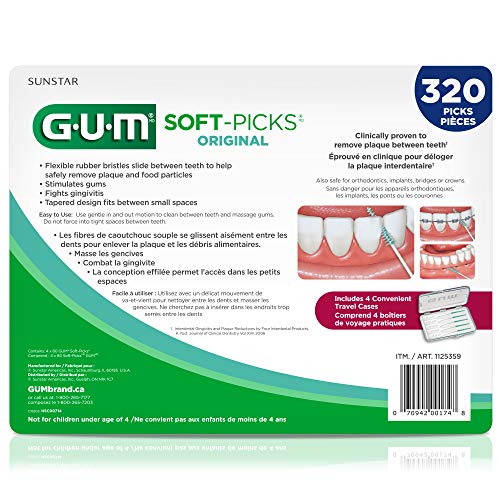Interdental space being cleaned between teeth with Soft Picks