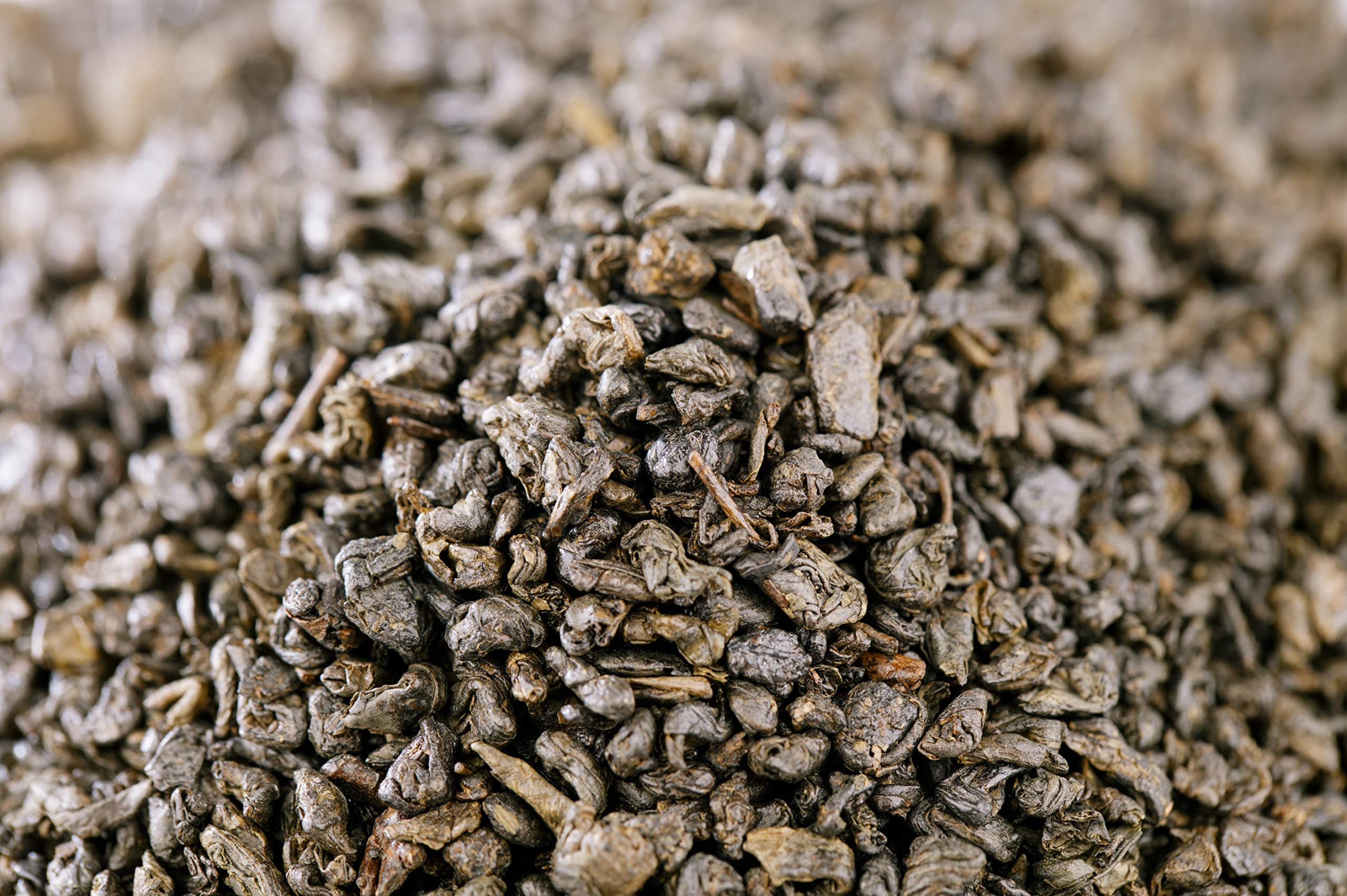 Brewing gunpowder green tea with hot water steeping