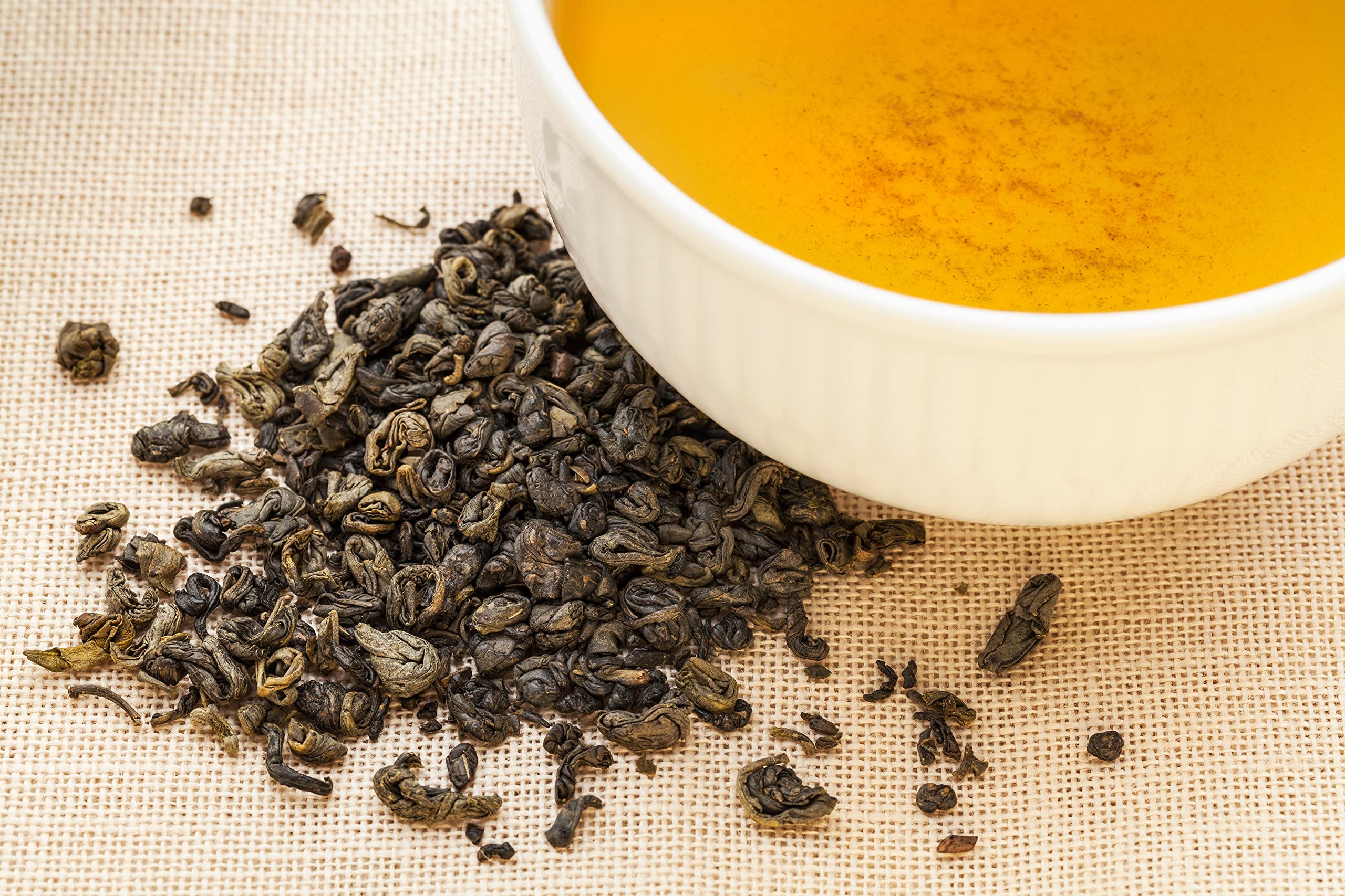 Dry gunpowder green tea pellets in natural light