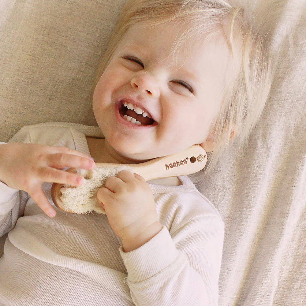 Close-up of blue wooden baby hair brush