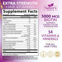 Close-up of yellow biotin gummies on white surface