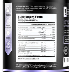 Close-up of hair growth vitamins bottle and capsules