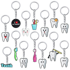 Assorted tooth-shaped keychains in 12 styles (36 pieces total)