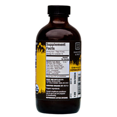 Bottle of Herbal Revolution Digestive Tonic on a wooden surface
