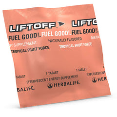 Herbalife Liftoff Tropical Fruit Force effervescent in a glass with fizz.