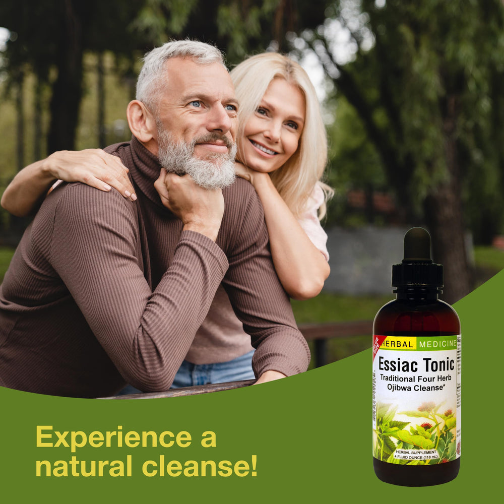 Pouring Essiac Tonic into glass with drops