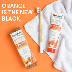 Foaming toothpaste on toothbrush with minty freshness