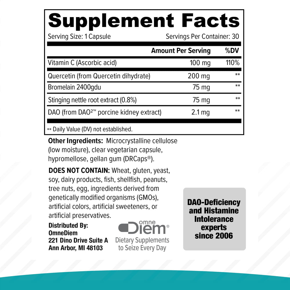 Capsules poured from Histamine Complete bottle onto a wooden surface