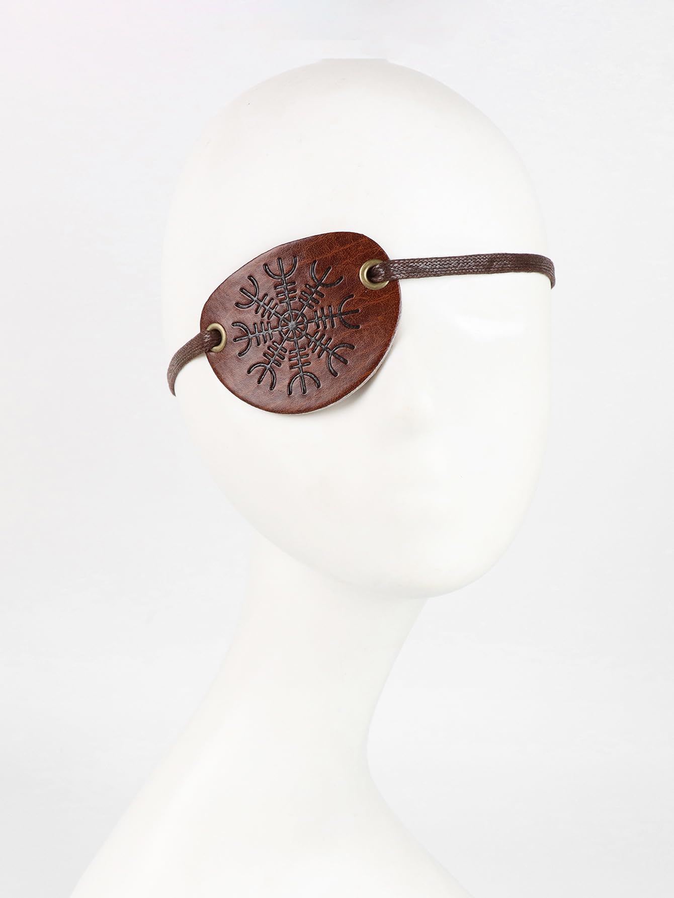 Close-up of faux leather texture and metal buckle