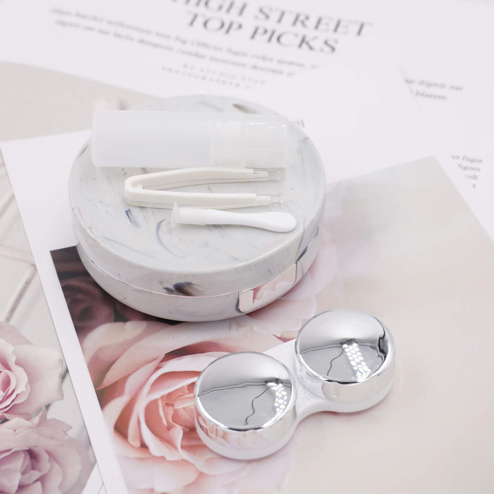 Rose gold round contact lens case open with built-in mirror