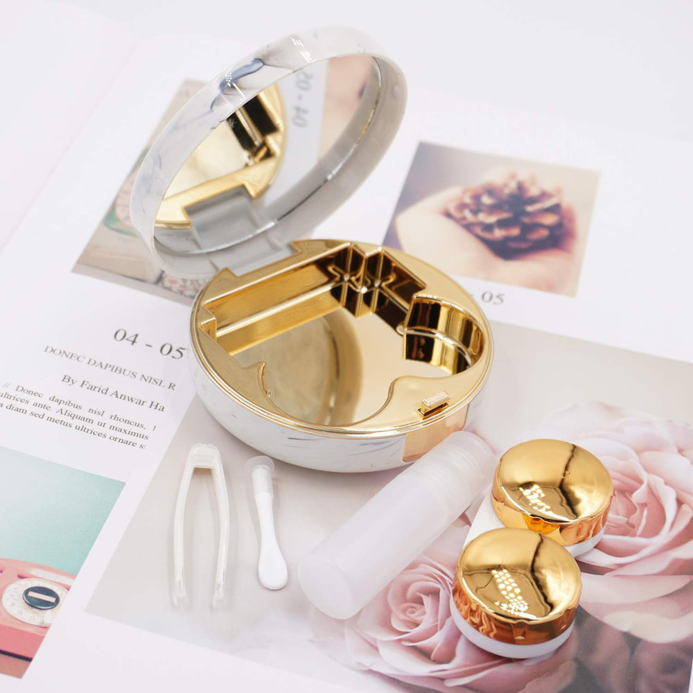 Close-up of the round rose gold lens case with built-in mirror