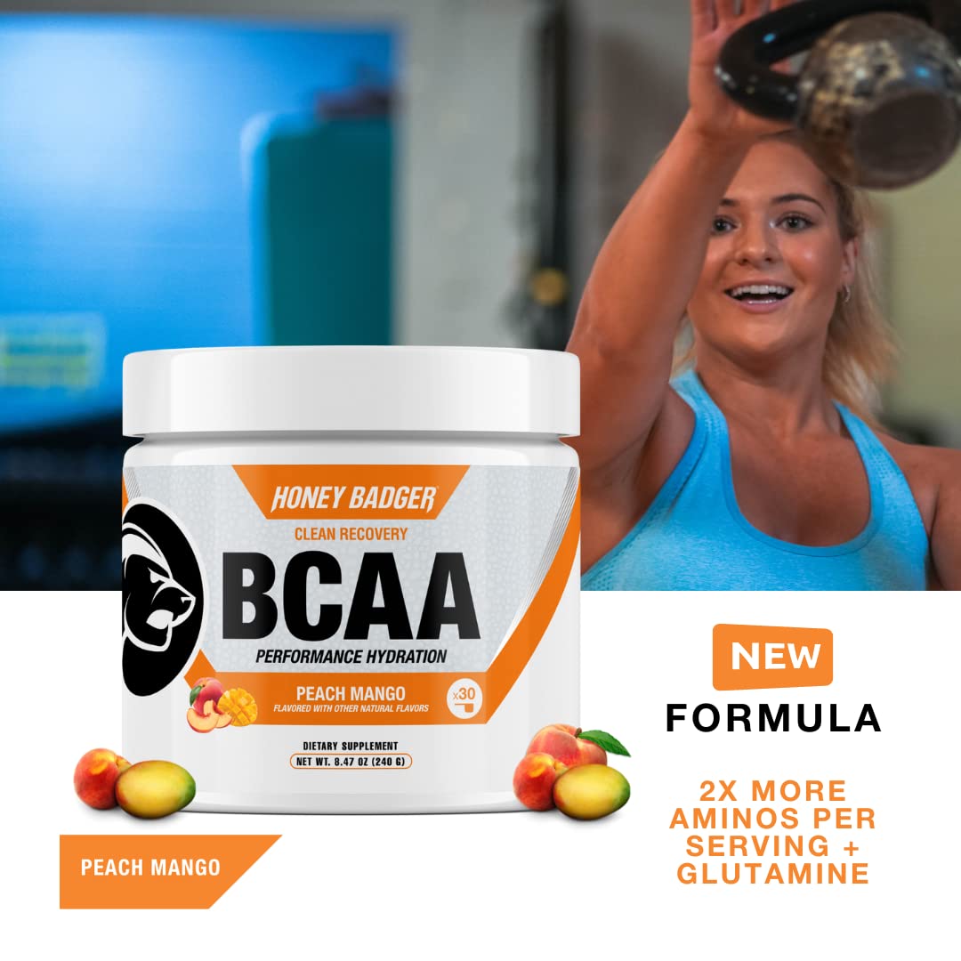 Scoop of Honey Badger BCAA + EAA powder being added to water
