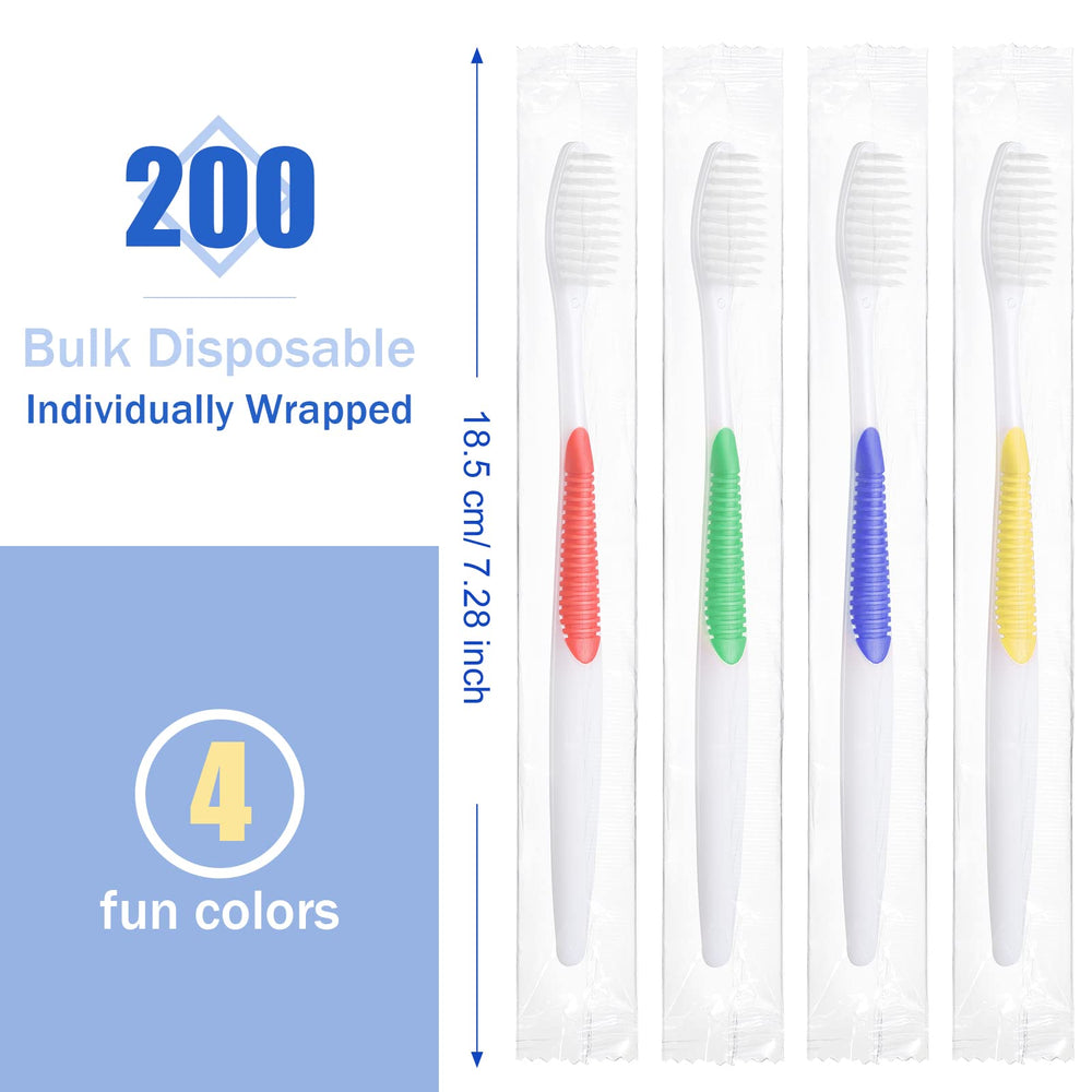 Individually wrapped disposable toothbrushes in red, green, blue, and yellow