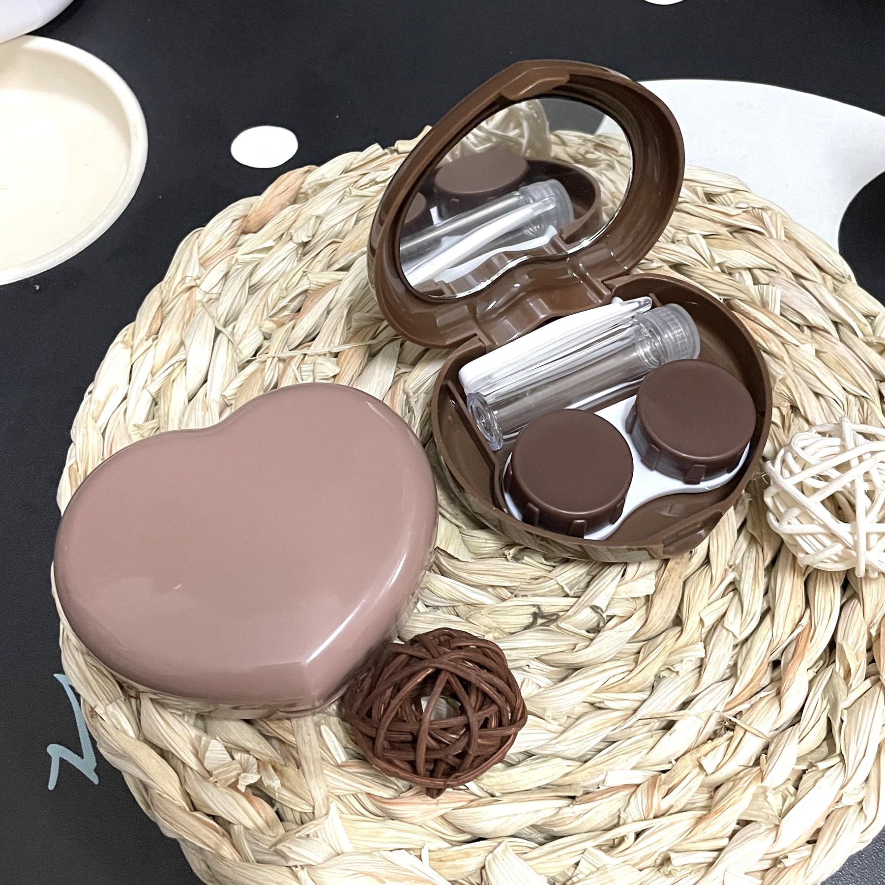 Portable Howinn contact lens case in dark brown with accessories