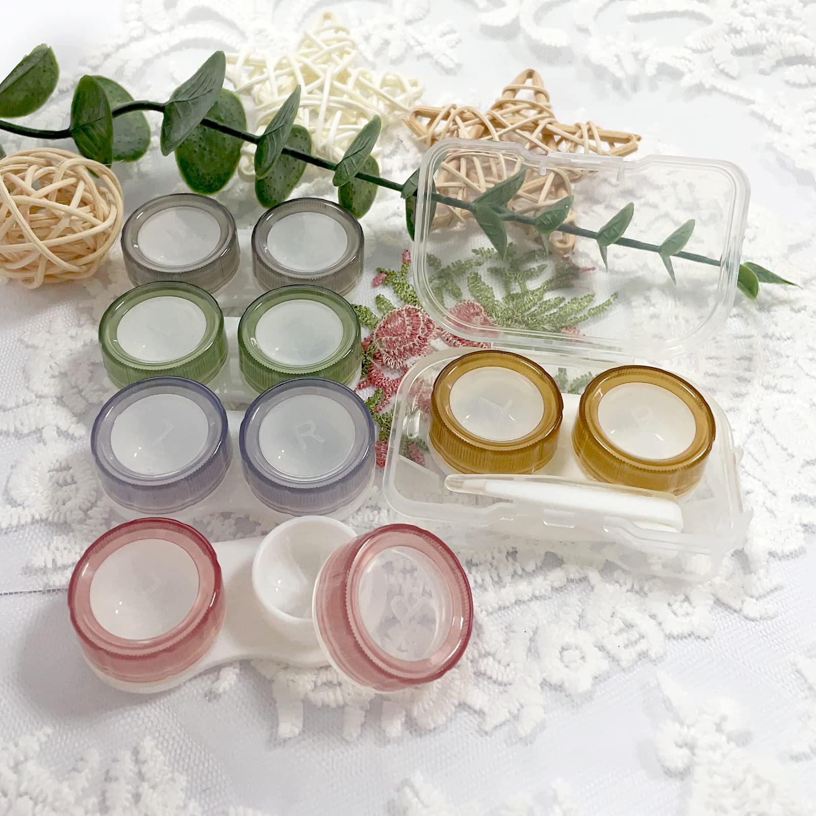 Close-up of swivel-cap contact lens case in pink with clear lid