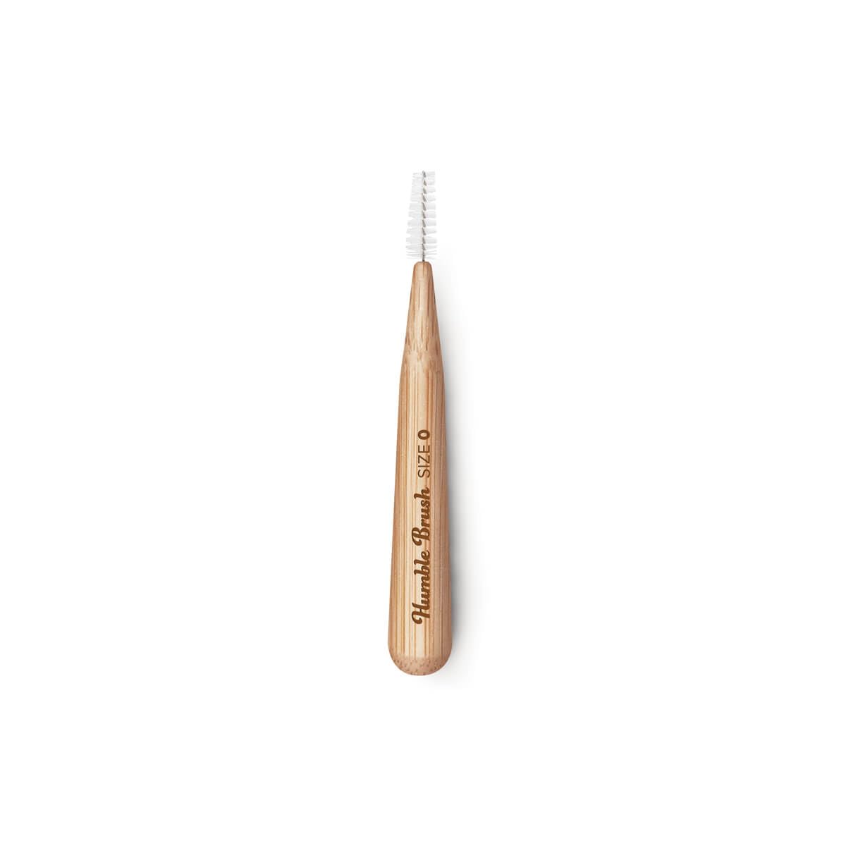 Close-up of The Humble Co Bamboo Interdental Brush showing bamboo handle and purple hue