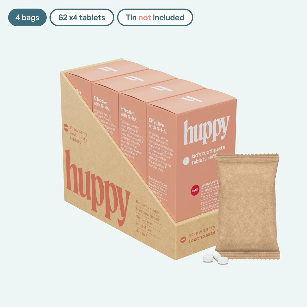 Close-up of HUPPY Strawberry toothpaste tablets in container